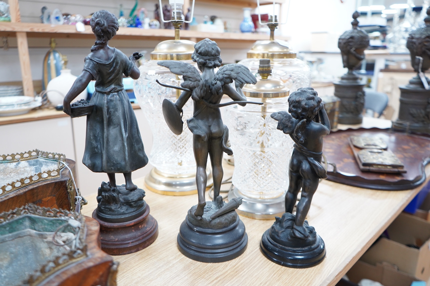 After Moreau - three statuettes, two bronze cherubs and a patinated spelter maiden, ‘Les Cerises’